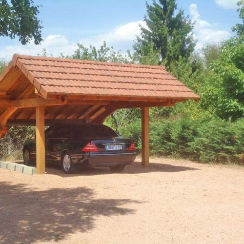 Carport bois pente asymétrique couverture tuiles au Vernet