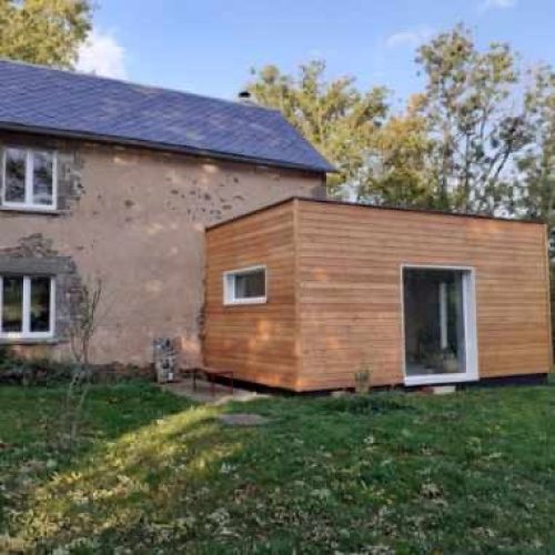 Extension ossature bois bardage Mélèze couverture membrane d&rsquo;étanchéité à Bromont Lamothe