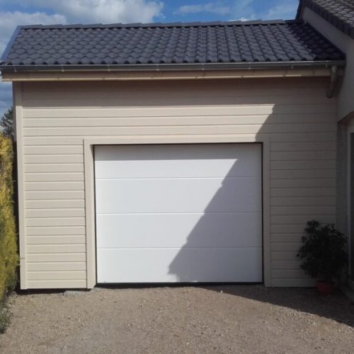 Garage ossature bois bardage bois peint à Etroussat